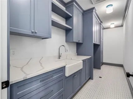 a kitchen with a sink and cabinets