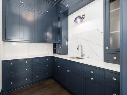 a kitchen with a sink and cabinets