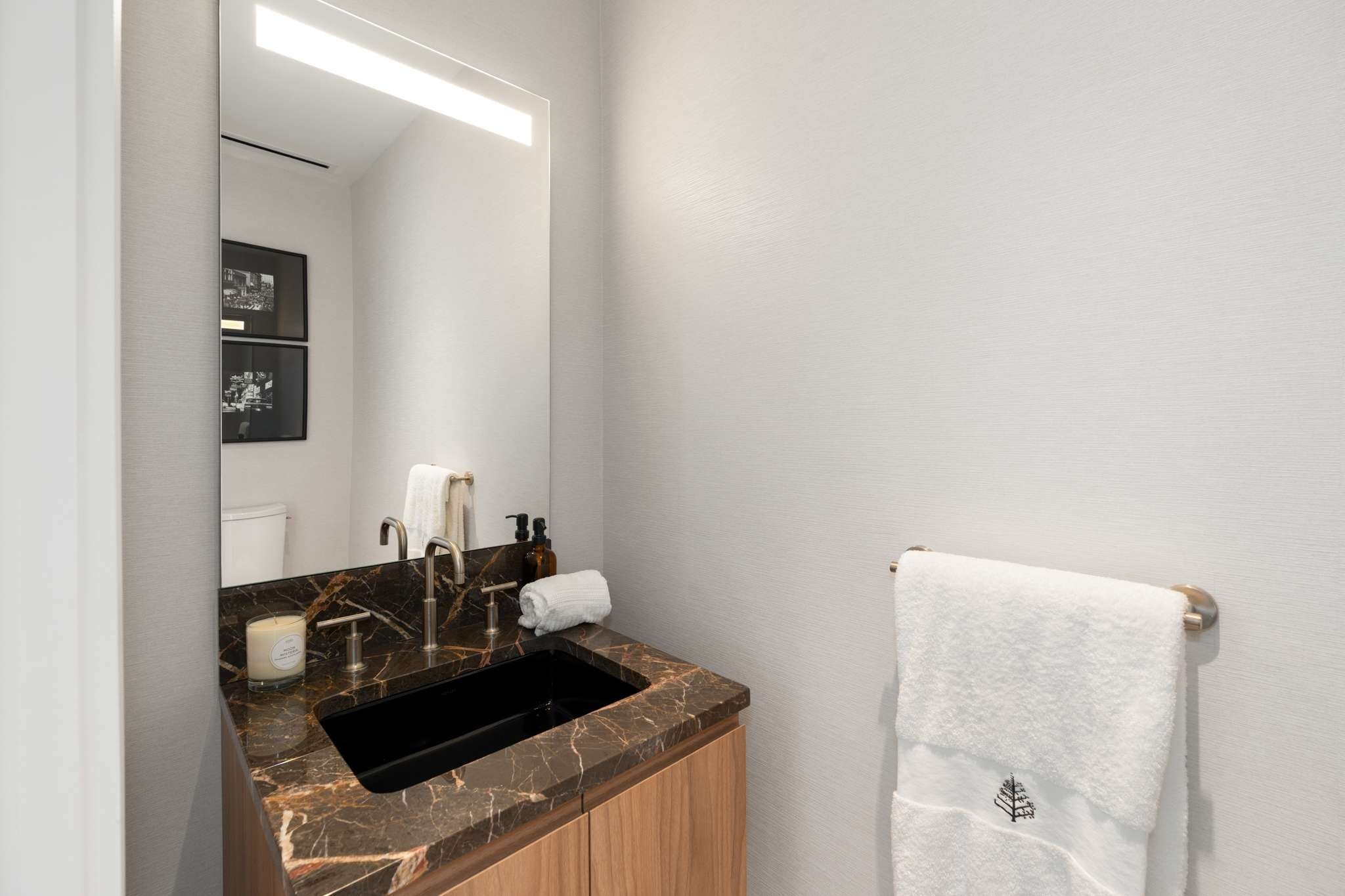 160 2nd Avenue South, Unit 1902 Nashville, TN 37201 - Photo 11 of 40 a bathroom with a sink and a mirror