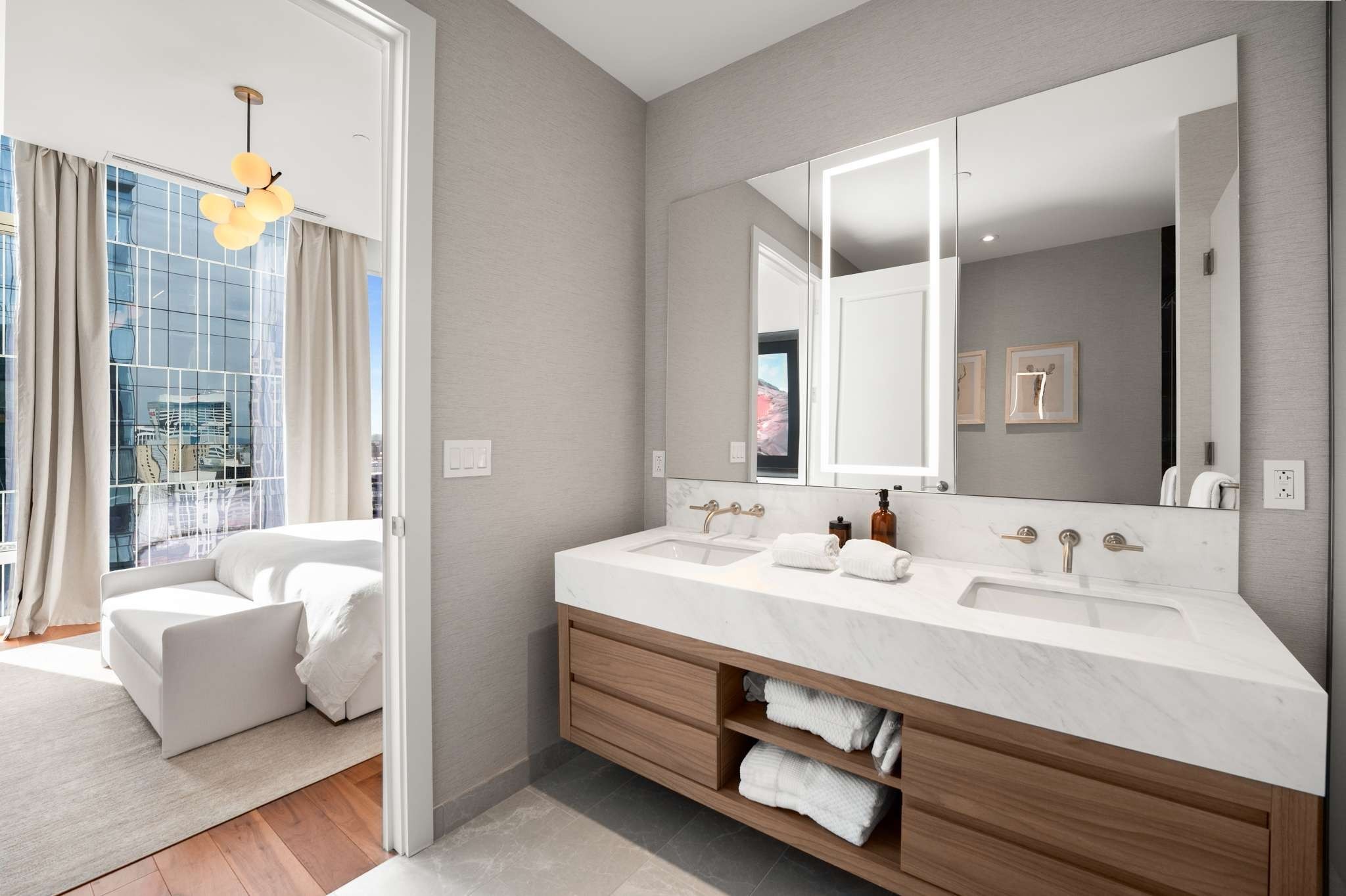 160 2nd Avenue South, Unit 1902 Nashville, TN 37201 - Photo 15 of 40 a bathroom with a sink double vanity and a mirror