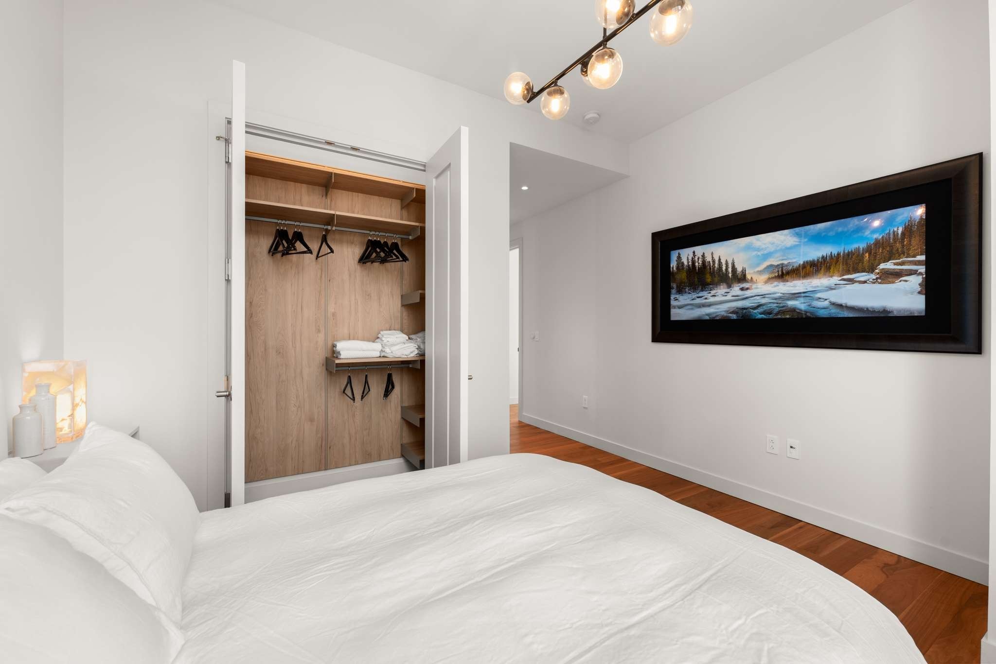 160 2nd Avenue South, Unit 1902 Nashville, TN 37201 - Photo 19 of 40 a bedroom with a bed and a painting on the wall