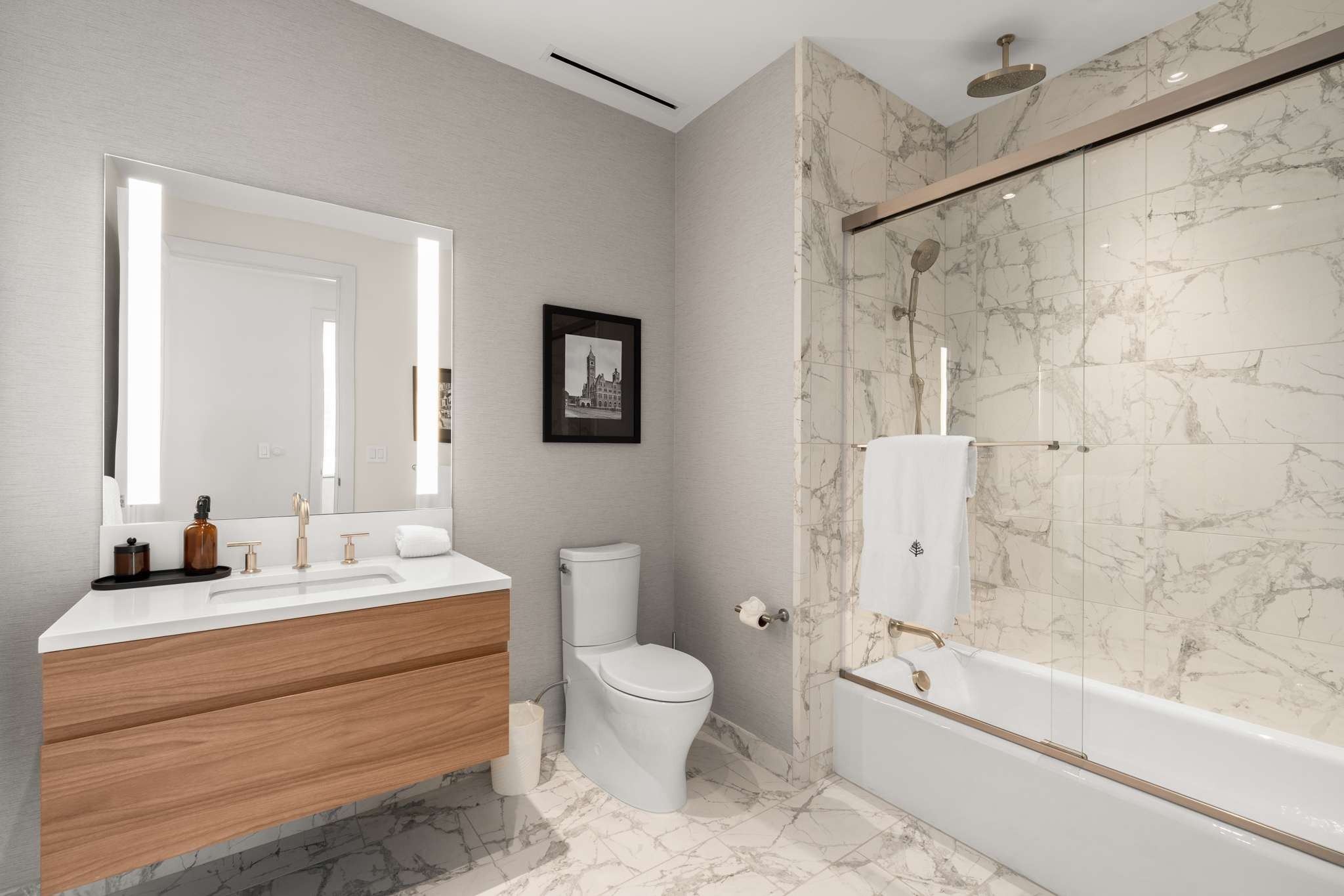 160 2nd Avenue South, Unit 1902 Nashville, TN 37201 - Photo 20 of 40 a bathroom with a double vanity sink toilet mirror and bathtub