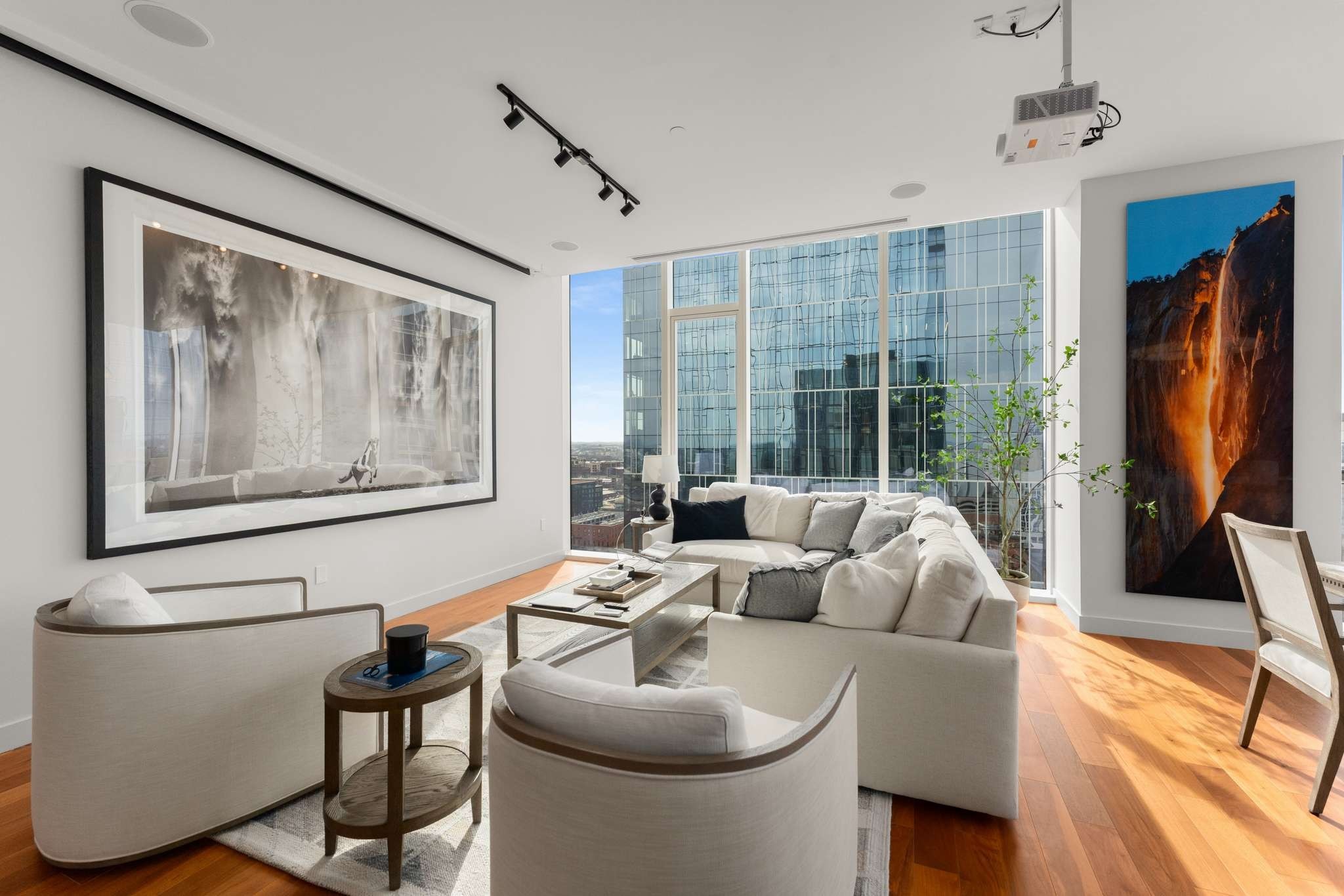 160 2nd Avenue South, Unit 1902 Nashville, TN 37201 - Photo 4 of 40 a living room with furniture a flat screen tv and a large window