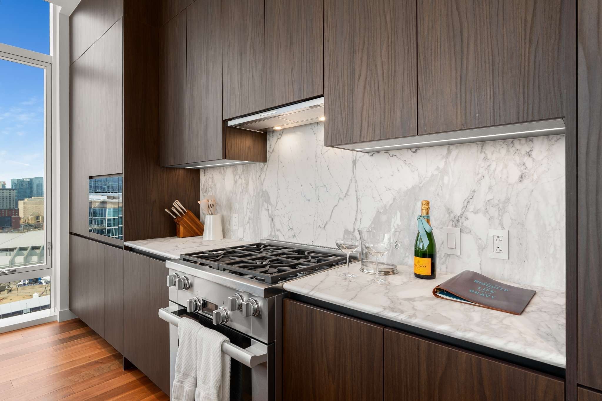 160 2nd Avenue South, Unit 1902 Nashville, TN 37201 - Photo 9 of 40 a kitchen with granite countertop cabinets and stove
