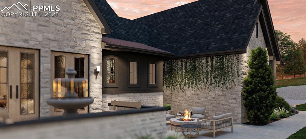 11809 Flap Jack Lane Colorado Springs, CO 80908 - Photo 3 of 18 a front view of a house with outdoor seating and water fountain