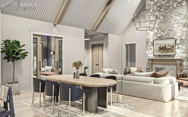 a living room with furniture a table and chairs