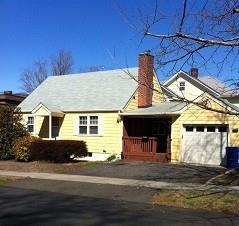 2 Ludlow Manor Norwalk, CT 06855 - Photo 1 of 1 a front view of a house with a garden