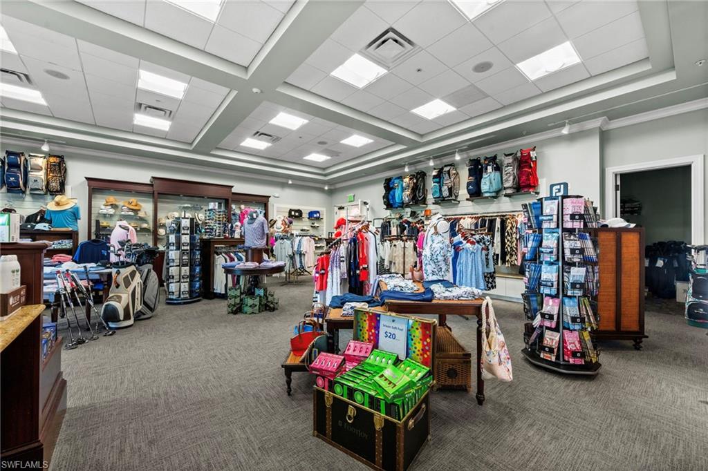 9331 Spring Run Boulevard, Unit 3005 Estero, FL 34135 - Photo 36 of 48 Recessed lighting, drop ceiling, wall-mounted display shelving, and wood-finish display cases