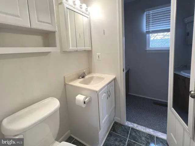 a utility room with sink dryer and washer