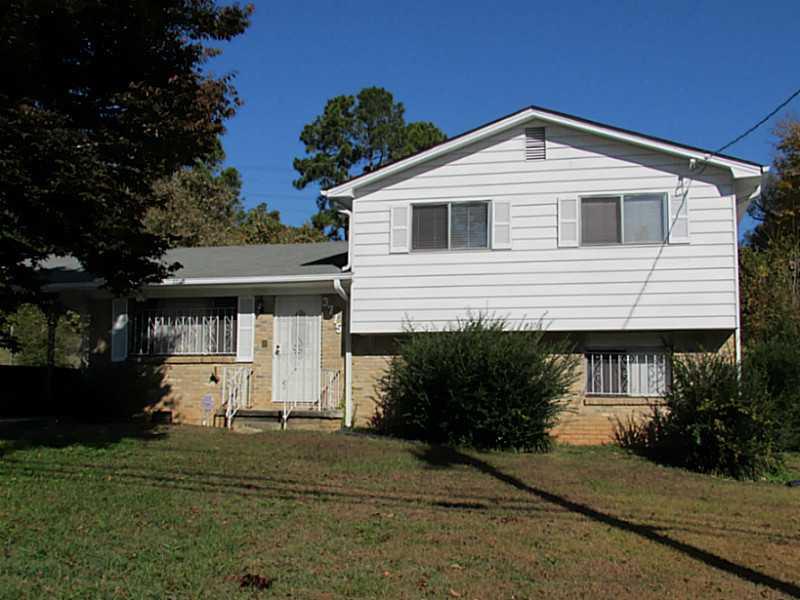 3775 Hogan Road Southwest Atlanta, GA 30331 - Photo 1 of 1 a front view of a house with a yard