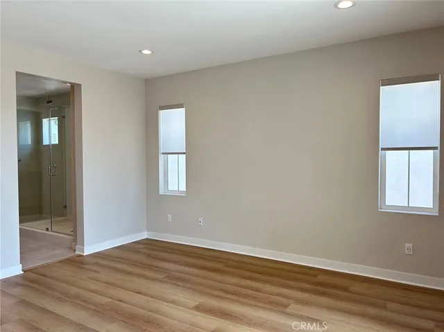 a view of a park with multi story buildings