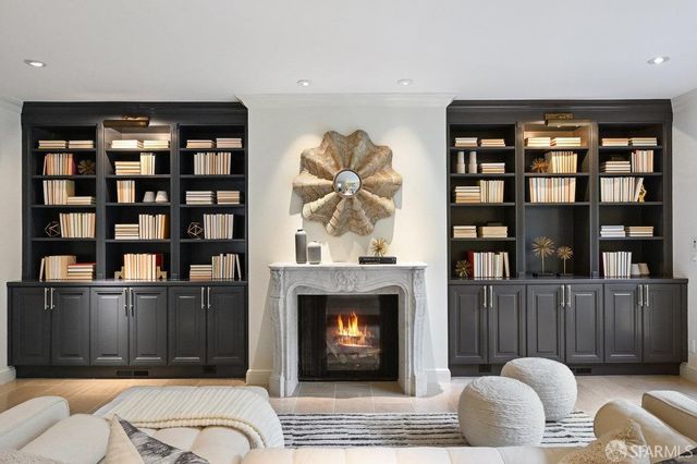 a kitchen with stainless steel appliances a sink a stove a refrigerator and cabinets