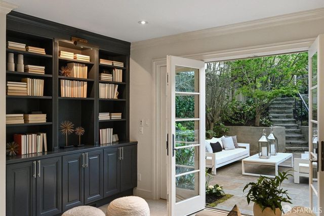 a bathroom with a sink mirror and vanity