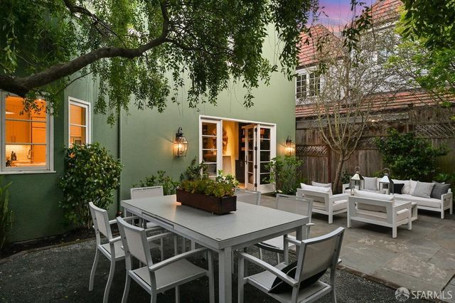 a bedroom with a bed gym equipment and a large window