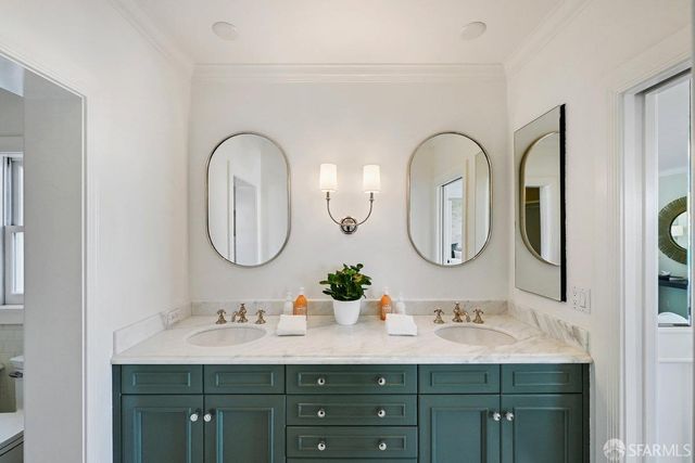 a balcony with furniture and a potted plant