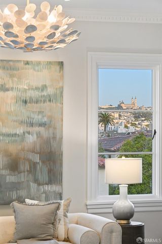 a living room with furniture a fireplace and a table