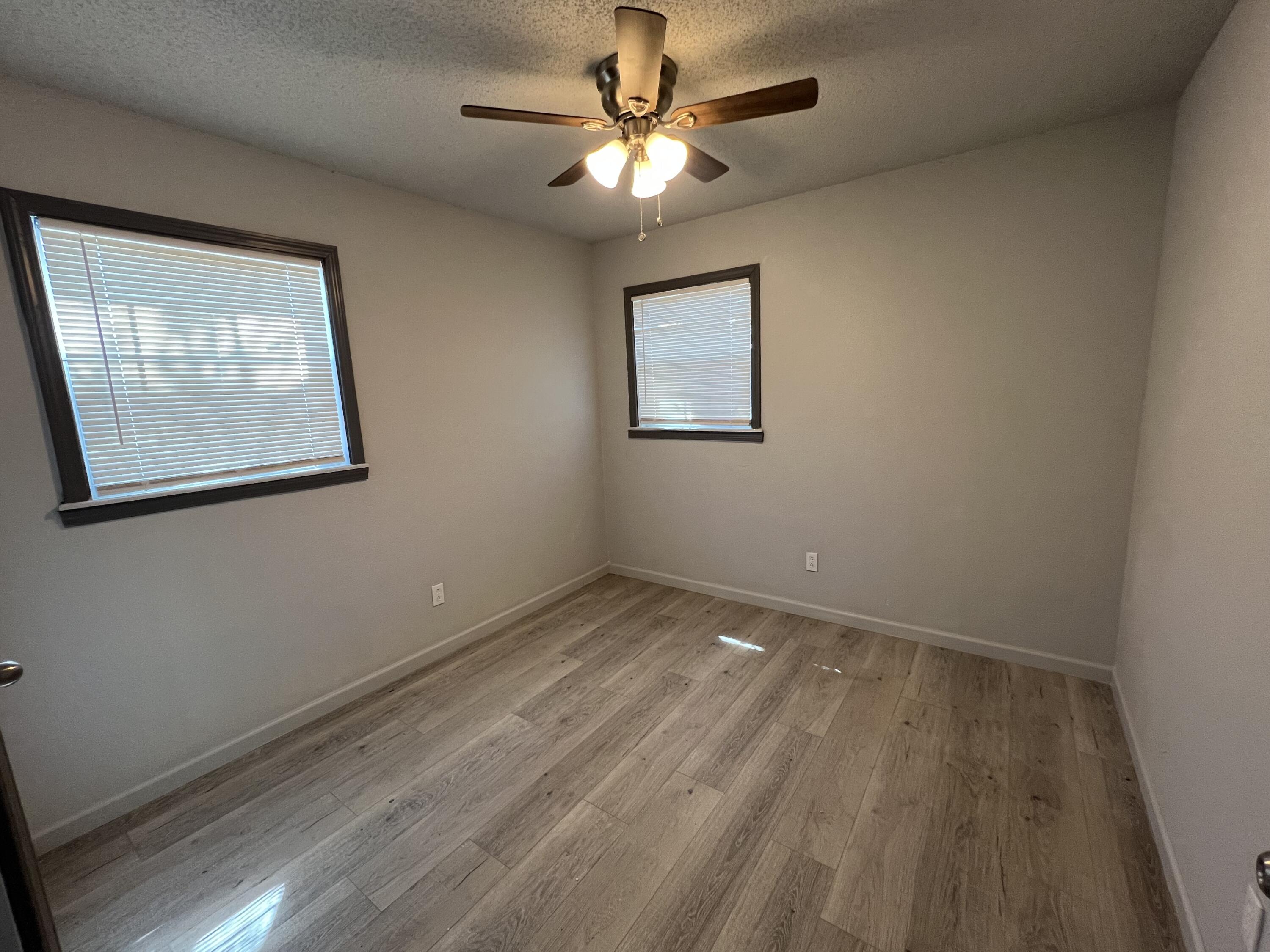 801 Vanda Avenue Lubbock, TX 79403 - Photo 13 of 13 a view of empty room with wooden floor