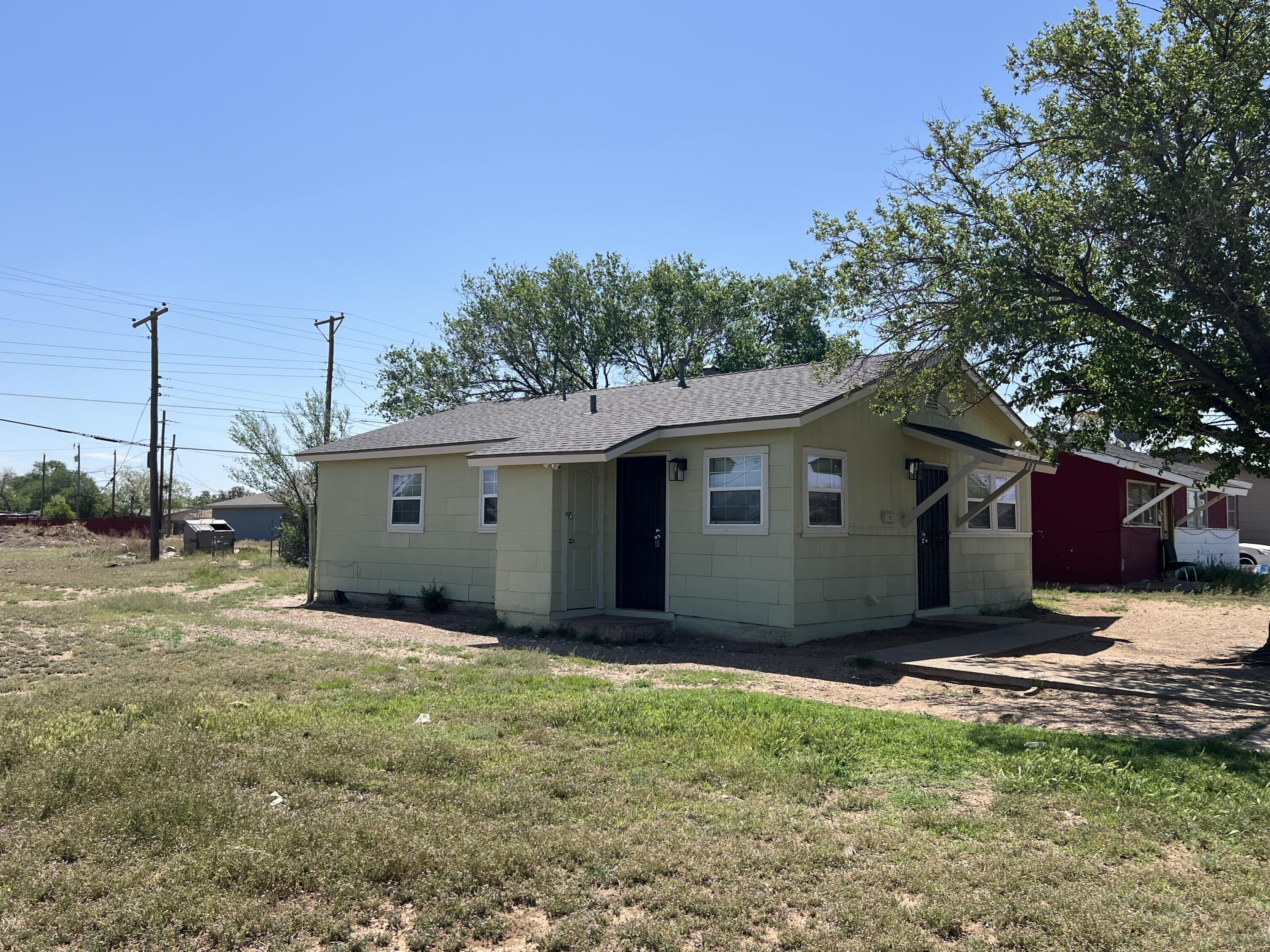 801 Vanda Avenue Lubbock, TX 79403 - Photo 2 of 13 a view of a house with a yard