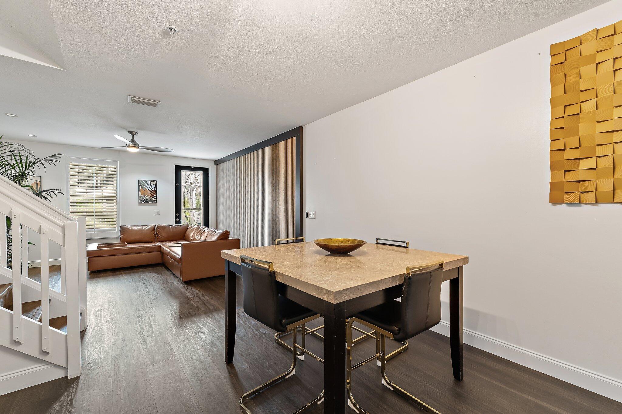 1101 Beach Road, Unit C Palm Beach Shores, FL 33404 - Photo 11 of 44 a view of a workspace with furniture and wooden floor