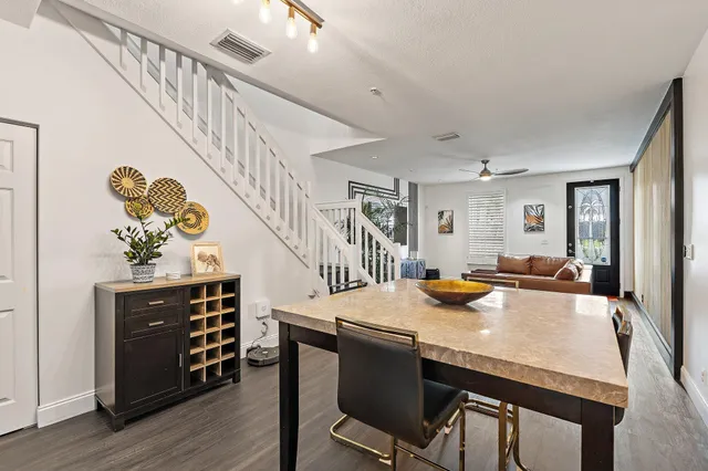 a view of a dining room with furniture and wooden floor