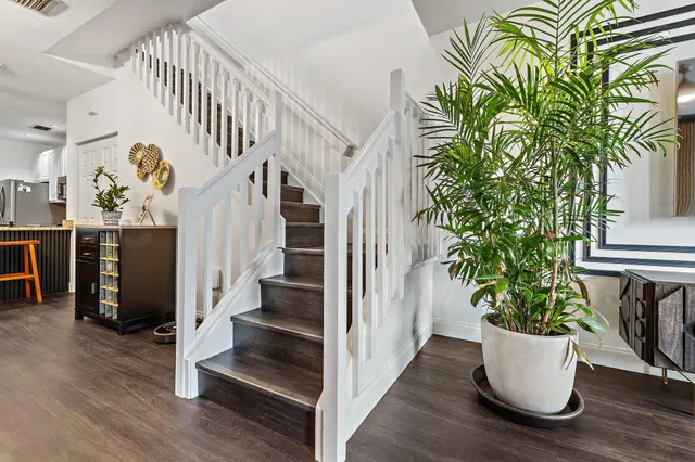 a view of entryway with stairs and wooden floor