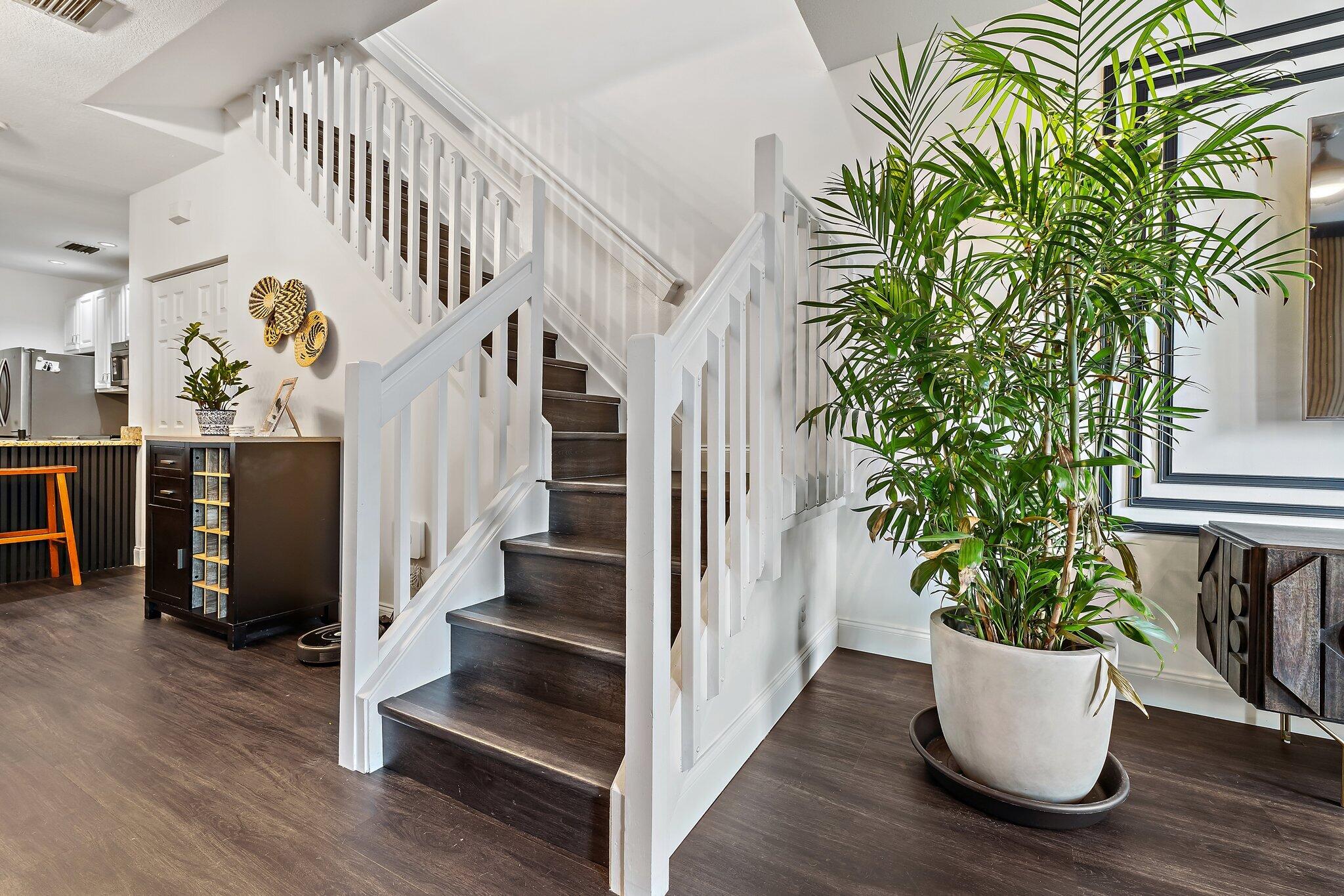 1101 Beach Road, Unit C Palm Beach Shores, FL 33404 - Photo 15 of 44 a view of entryway with stairs and wooden floor
