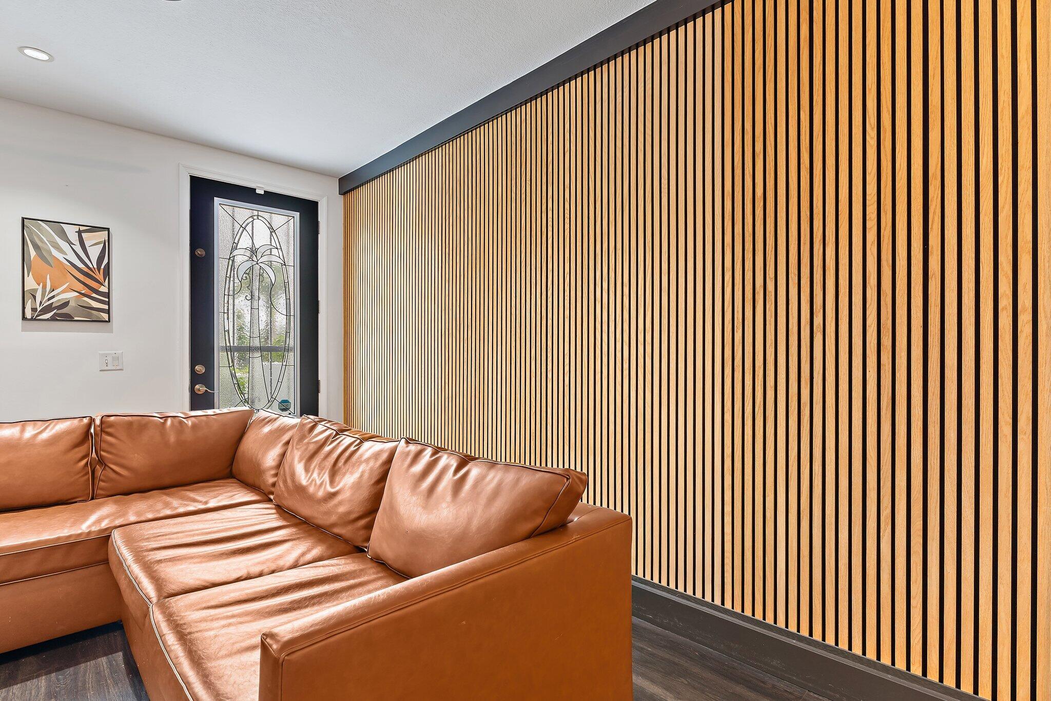 1101 Beach Road, Unit C Palm Beach Shores, FL 33404 - Photo 20 of 44 a living room with furniture and a large window