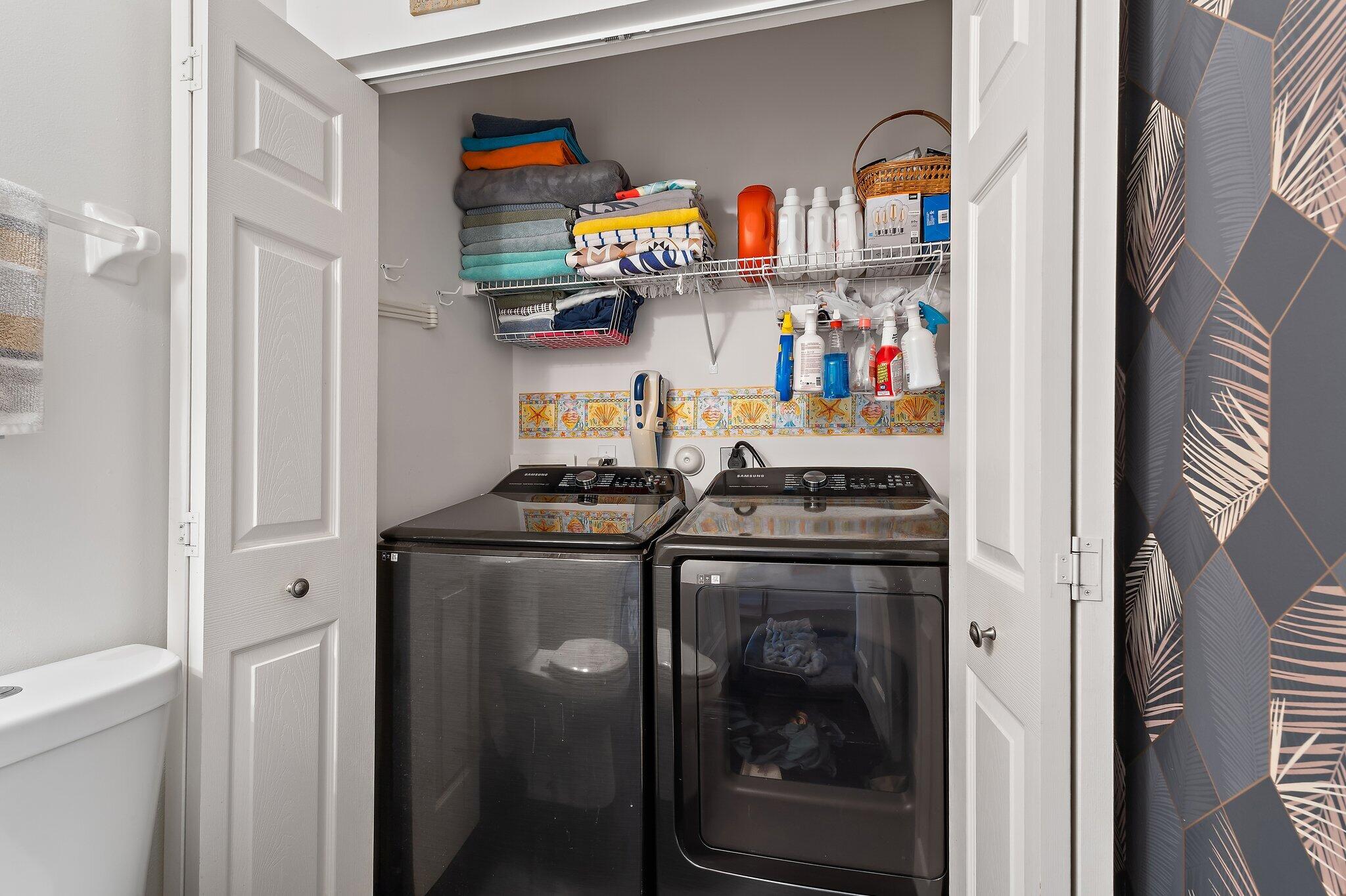 1101 Beach Road, Unit C Palm Beach Shores, FL 33404 - Photo 22 of 44 a utility room with stainless steel appliances granite countertop a stove and a refrigerator