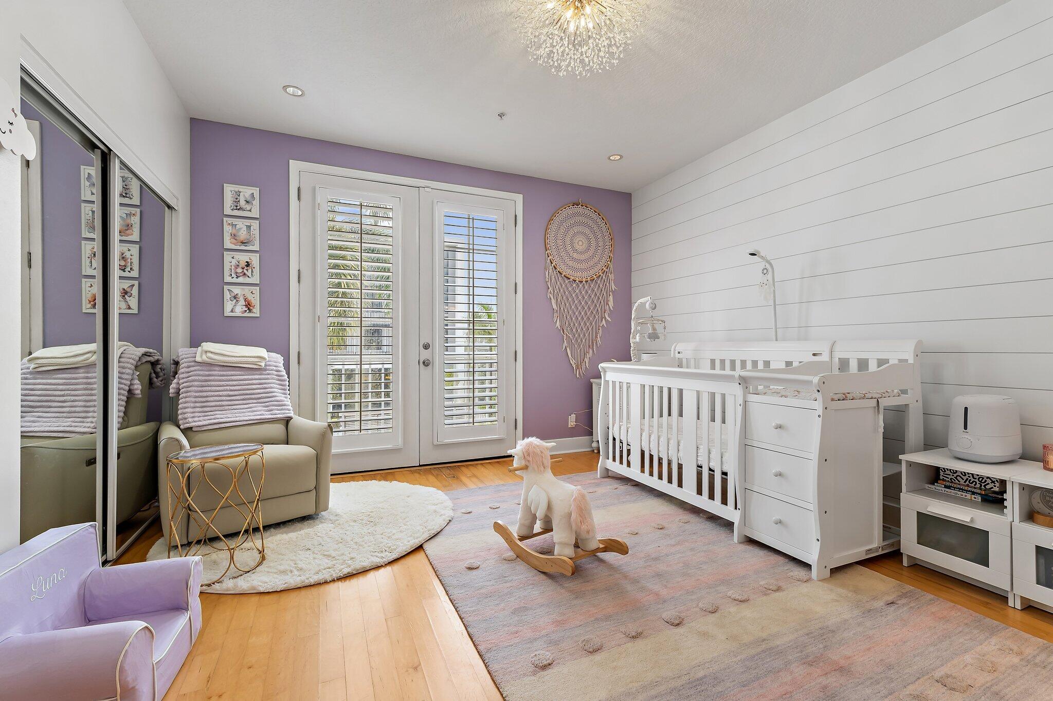 1101 Beach Road, Unit C Palm Beach Shores, FL 33404 - Photo 24 of 44 a bedroom with furniture and a window