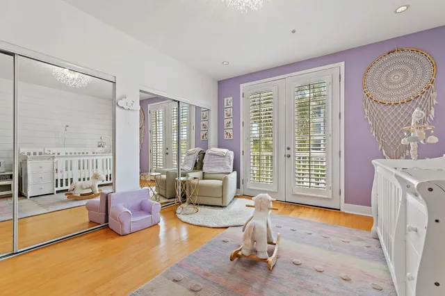 a living room with furniture and a floor to ceiling window