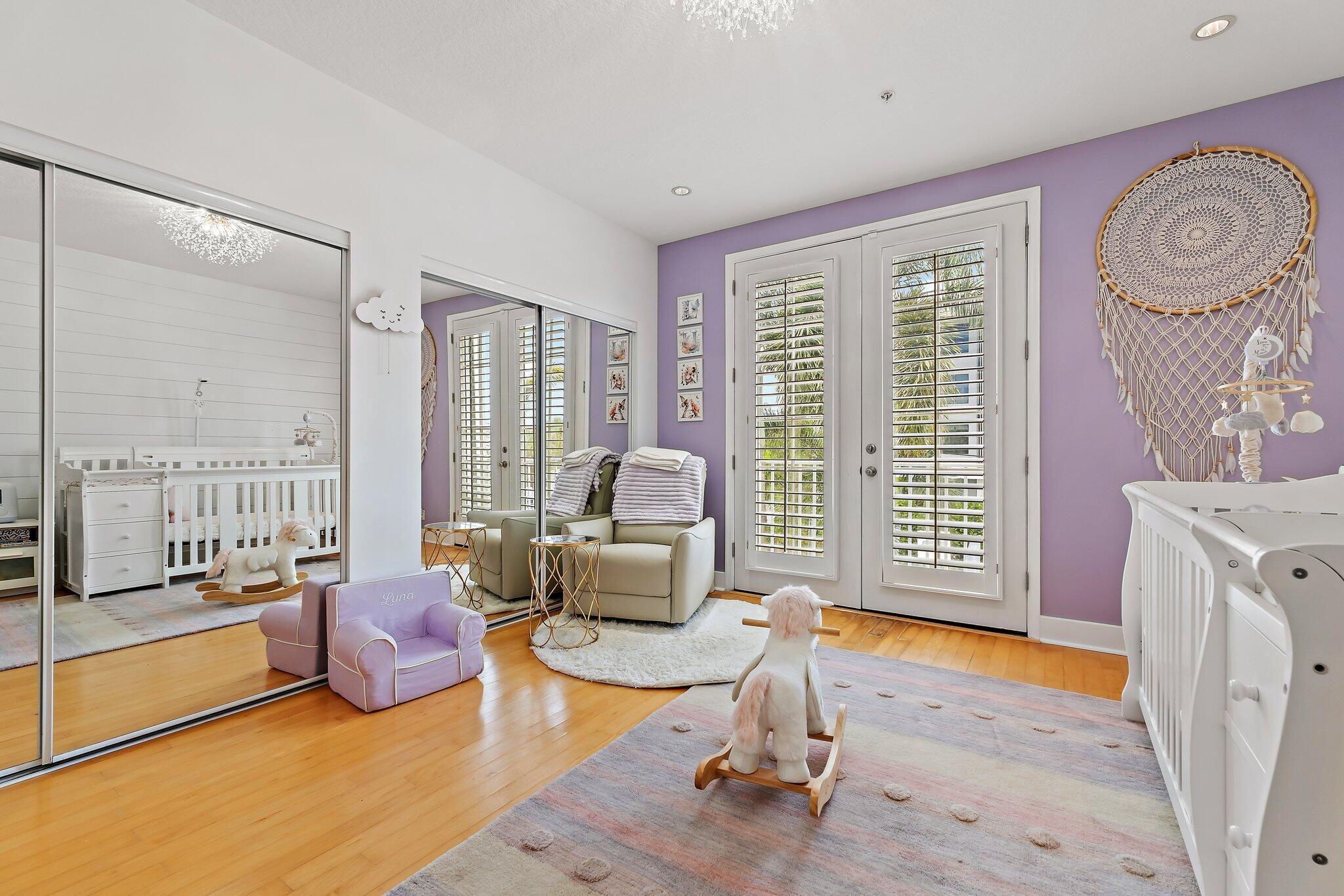 1101 Beach Road, Unit C Palm Beach Shores, FL 33404 - Photo 25 of 44 a living room with furniture and a floor to ceiling window
