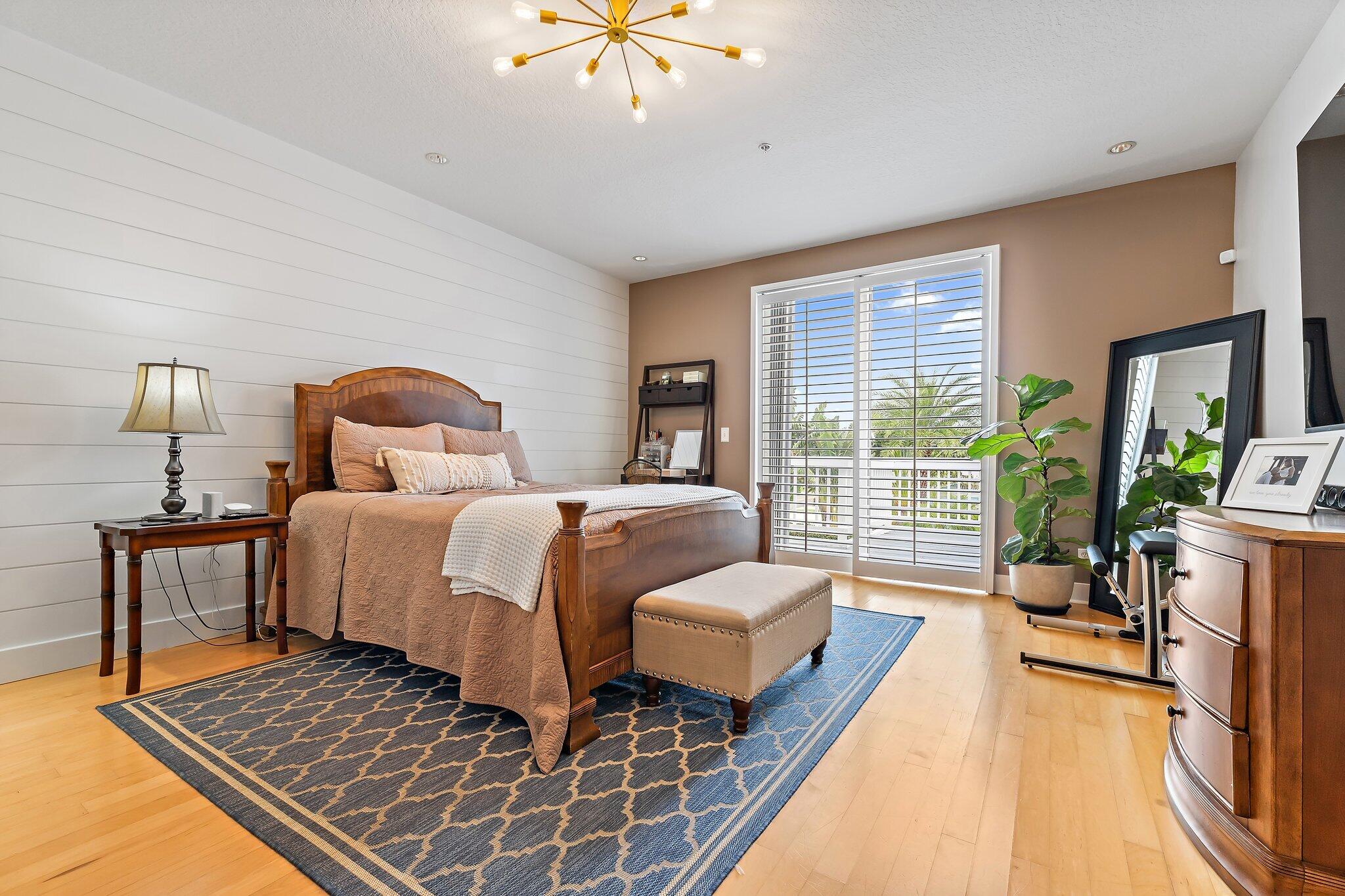 1101 Beach Road, Unit C Palm Beach Shores, FL 33404 - Photo 28 of 44 a bedroom with furniture and a large window