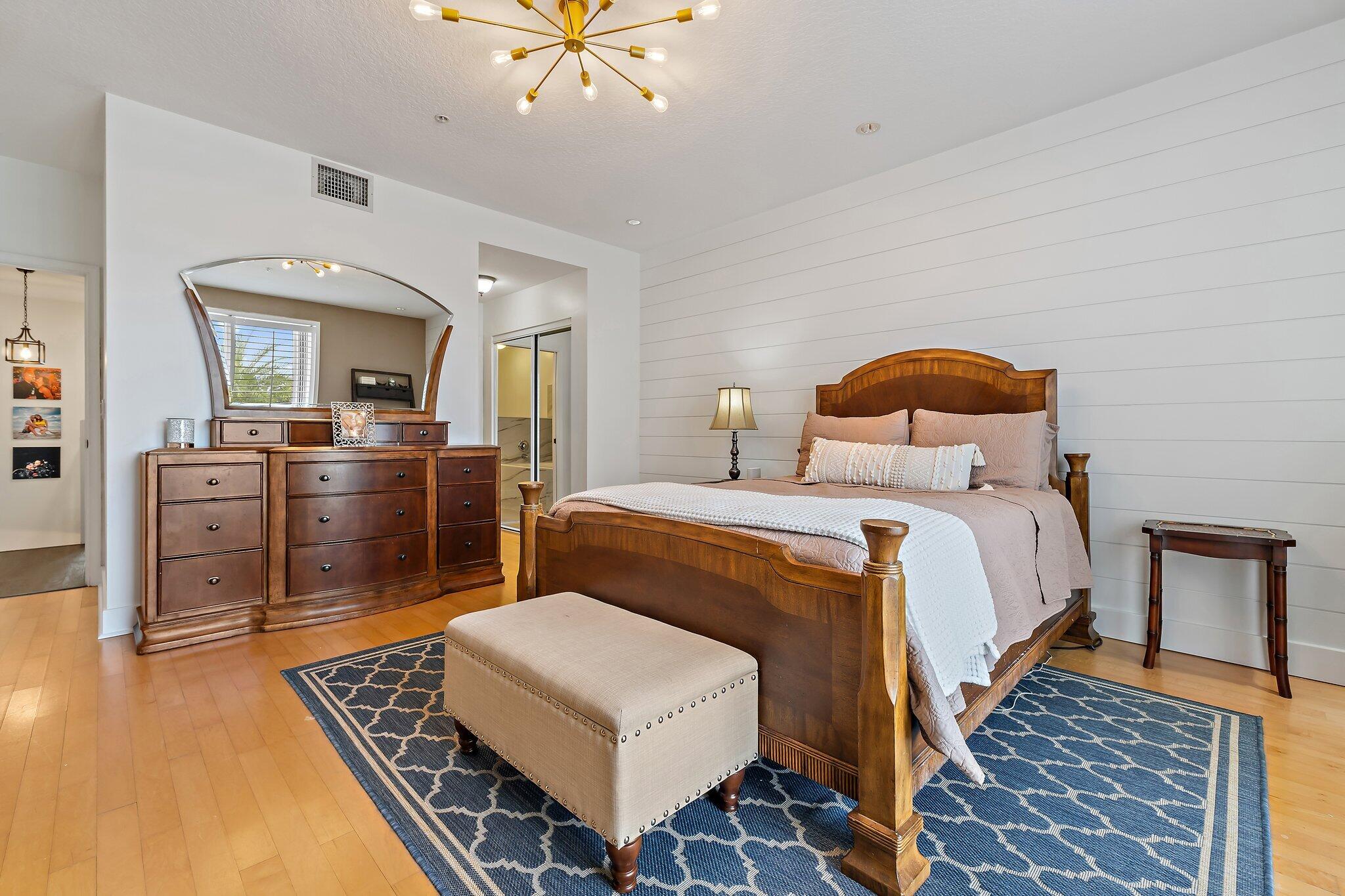 1101 Beach Road, Unit C Palm Beach Shores, FL 33404 - Photo 31 of 44 a bedroom with a bed and furniture