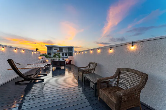 a view of a chairs and table on the deck