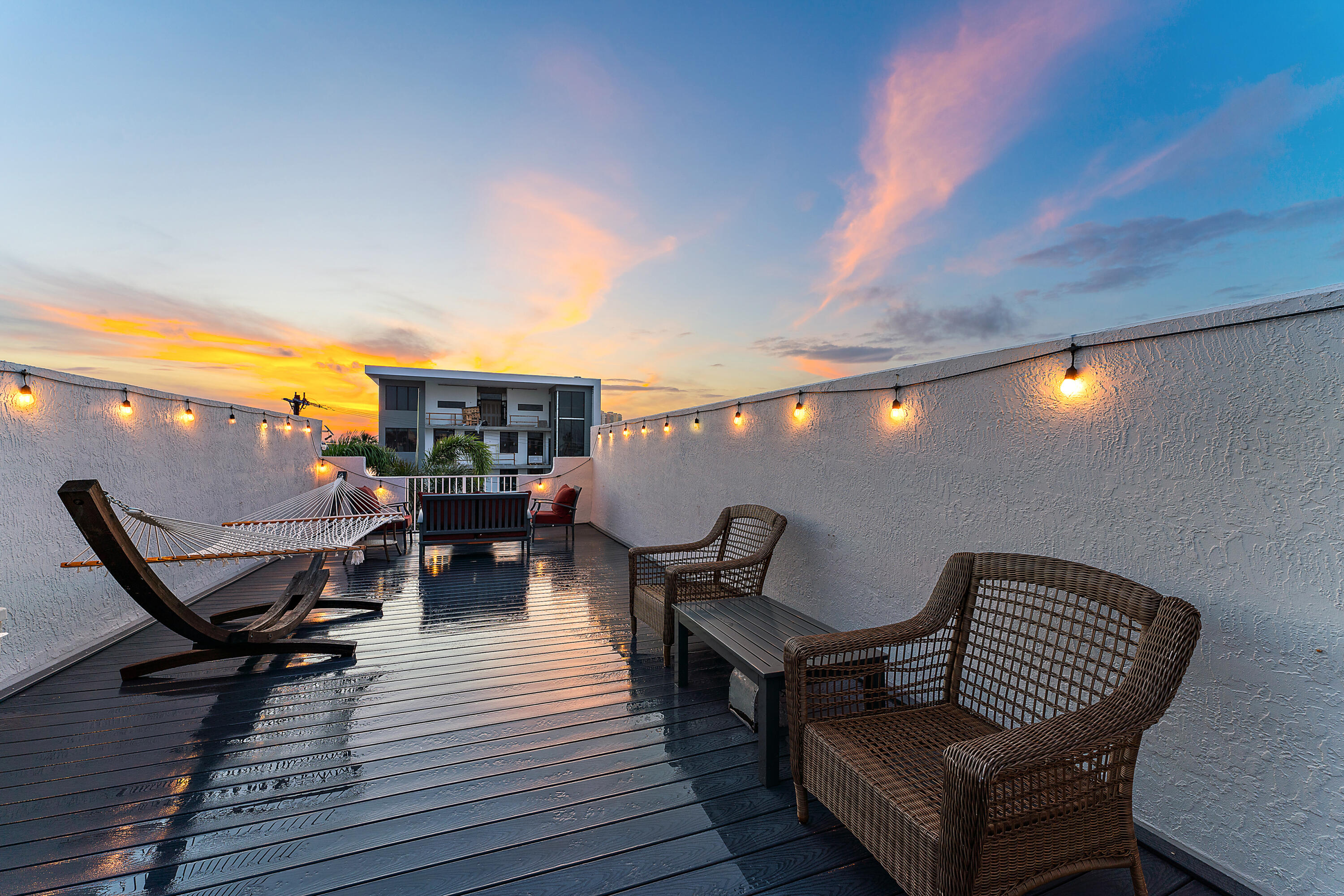 1101 Beach Road, Unit C Palm Beach Shores, FL 33404 - Photo 39 of 44 a view of a chairs and table on the deck