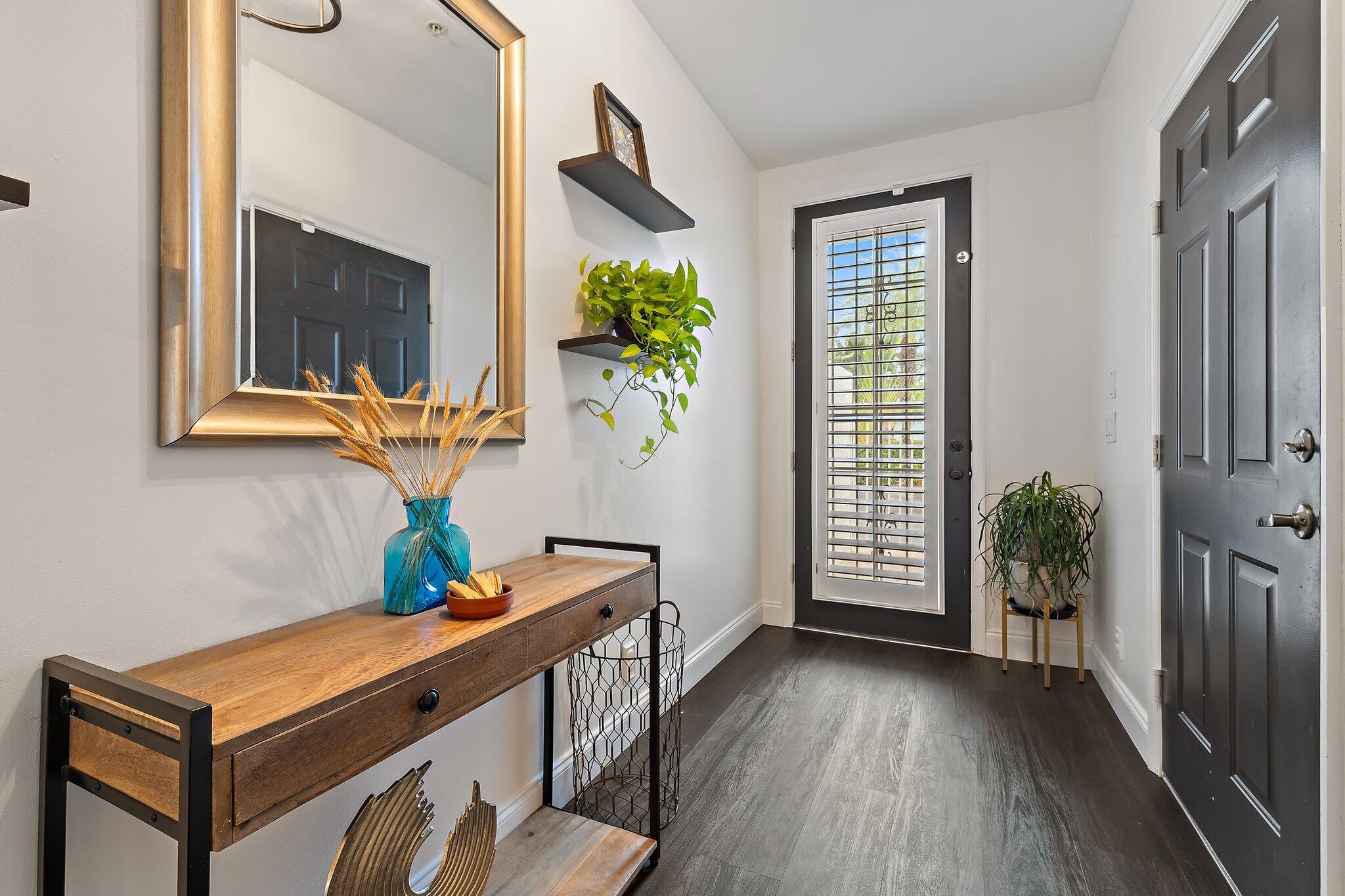 1101 Beach Road, Unit C Palm Beach Shores, FL 33404 - Photo 4 of 44 a view of an entryway with wooden floor