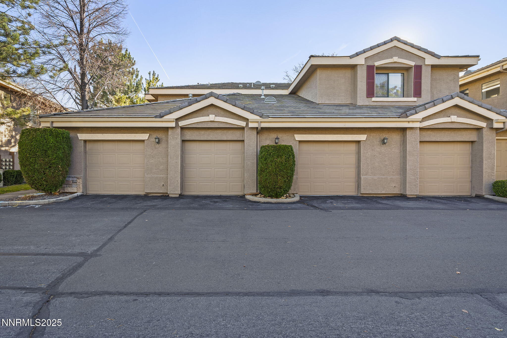 900 South Meadows Parkway, Unit 4321 Reno, NV 89521 - Photo 33 of 40 a front view of a house with a yard and garage