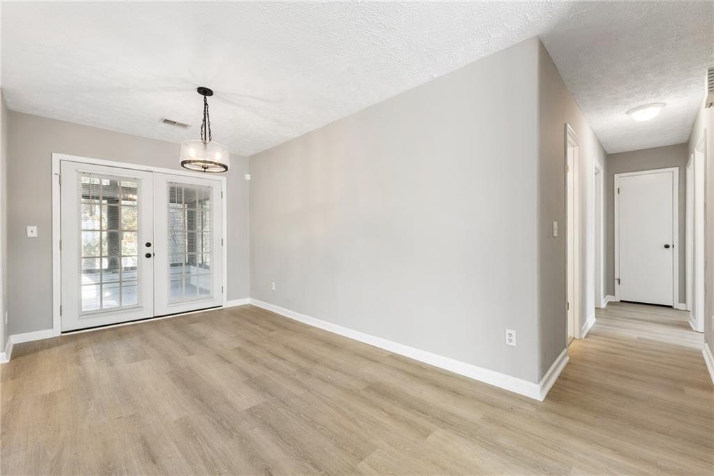130 Forrest View Terrace Johns Creek, GA 30022 - Photo 18 of 34 a view of an empty room with wooden floor and a window