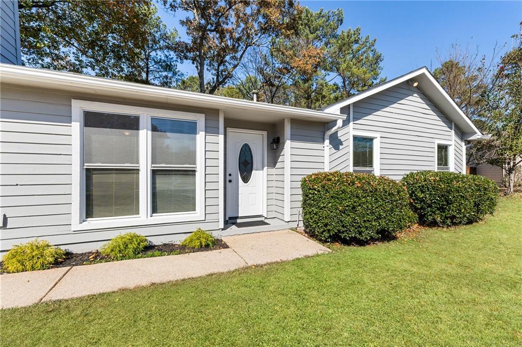 130 Forrest View Terrace Johns Creek, GA 30022 - Photo 2 of 34 a view of a house with a yard plants and large tree