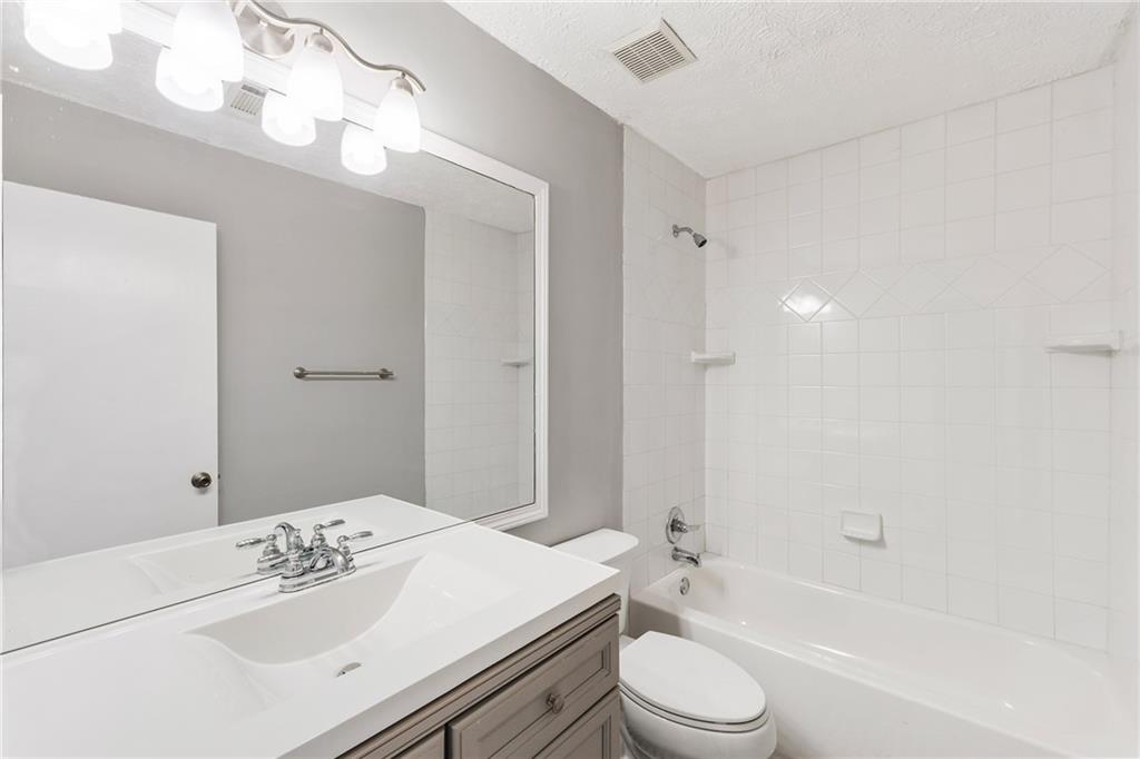 130 Forrest View Terrace Johns Creek, GA 30022 - Photo 25 of 34 a bathroom with a sink a toilet and shower