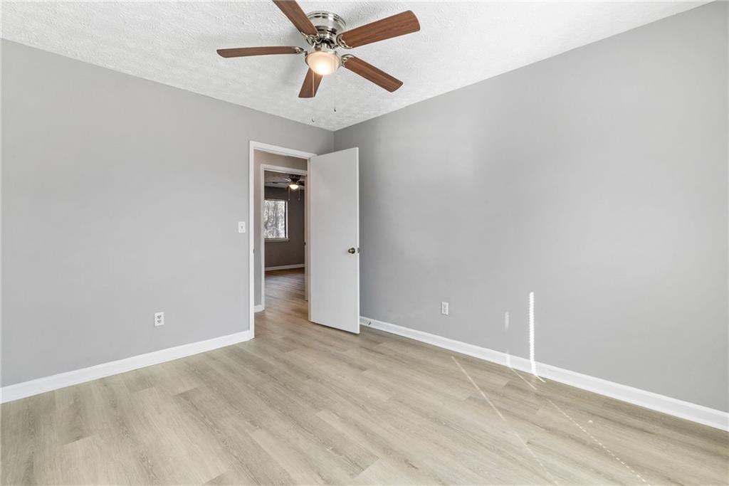 130 Forrest View Terrace Johns Creek, GA 30022 - Photo 27 of 34 an empty room with closet and a ceiling fan