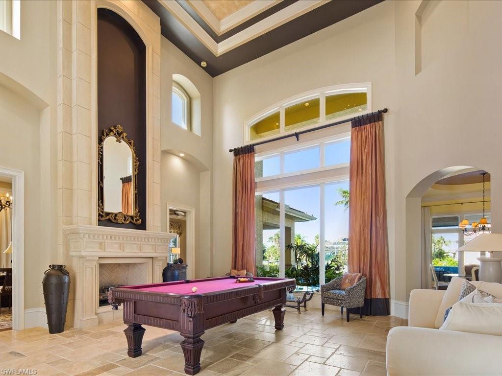 1550 Mullet Lane Naples, FL 34102 - Photo 14 of 50 a living room with furniture and windows