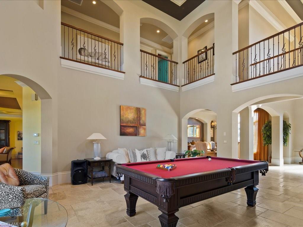 1550 Mullet Lane Naples, FL 34102 - Photo 17 of 50 a room with pool table and windows