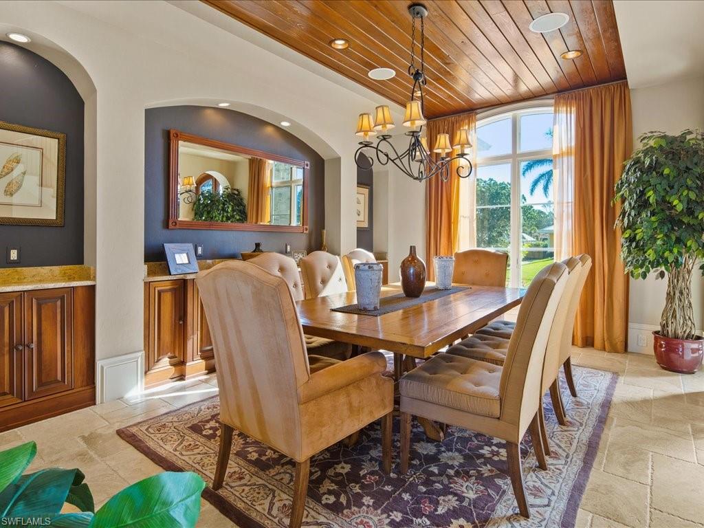 1550 Mullet Lane Naples, FL 34102 - Photo 18 of 50 a view of a dining room with furniture window and wooden floor