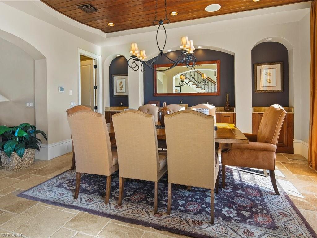 1550 Mullet Lane Naples, FL 34102 - Photo 19 of 50 a living room with furniture and wooden floor