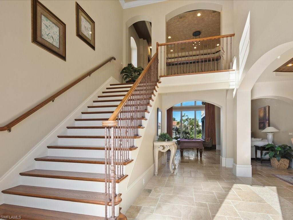 1550 Mullet Lane Naples, FL 34102 - Photo 20 of 50 a view of entryway and hall with wooden floor