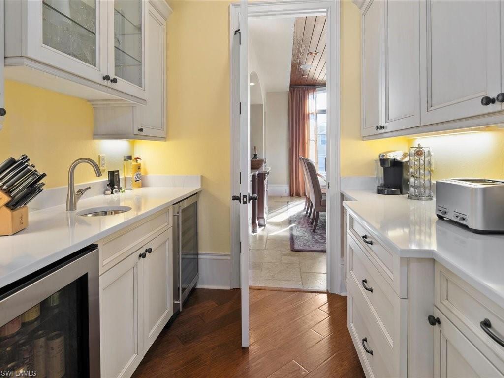 1550 Mullet Lane Naples, FL 34102 - Photo 23 of 50 a spacious bathroom with a double vanity sink a mirror and shower