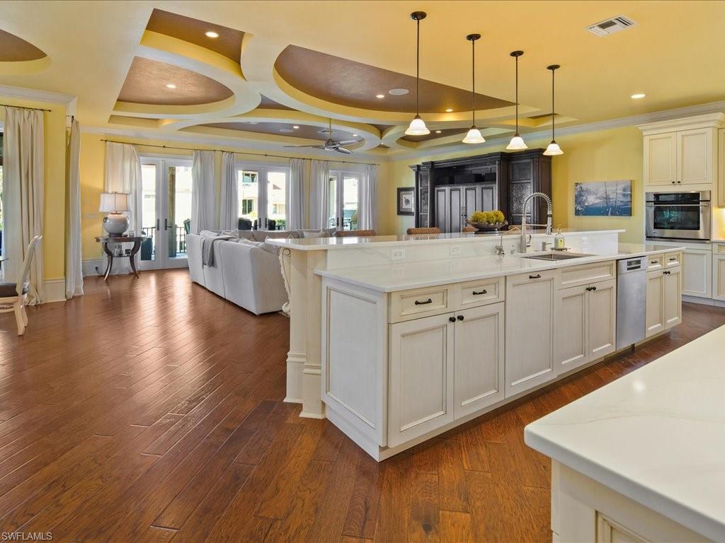 1550 Mullet Lane Naples, FL 34102 - Photo 26 of 50 a large kitchen with lots of counter space and appliances