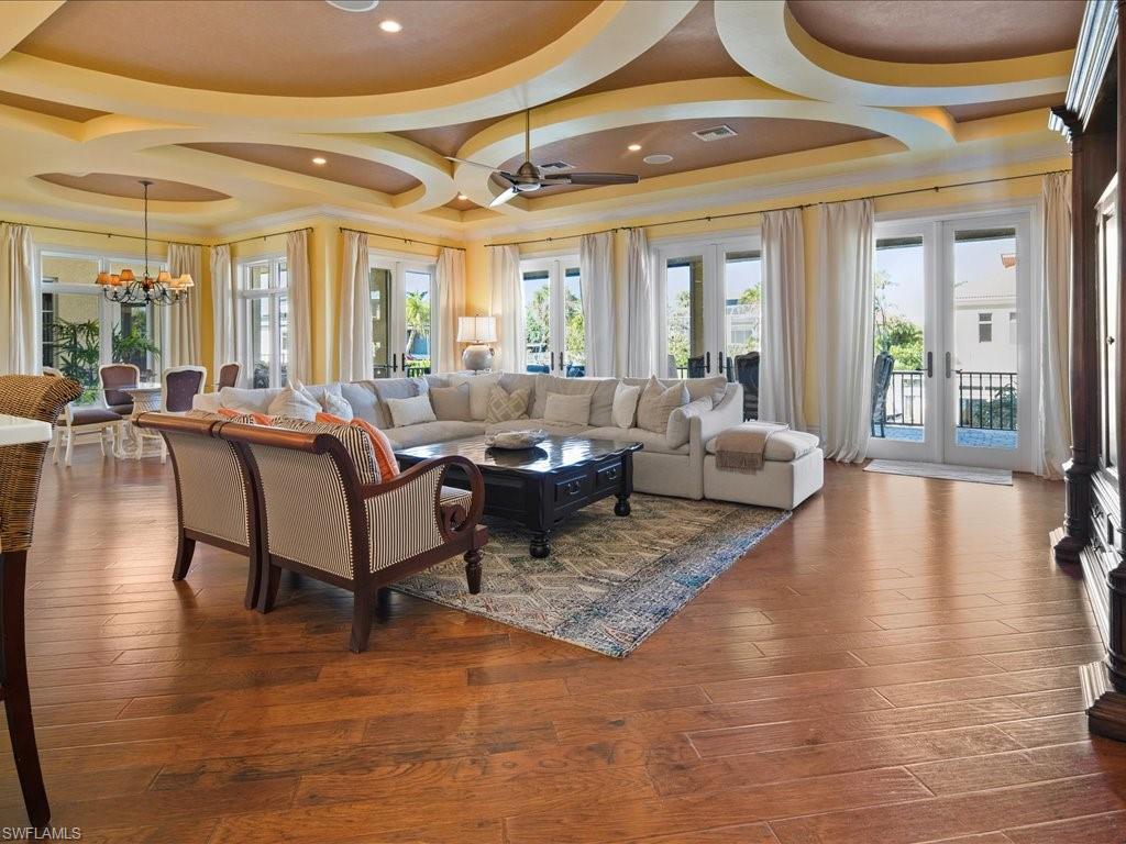 1550 Mullet Lane Naples, FL 34102 - Photo 28 of 50 a living room with furniture and a large window
