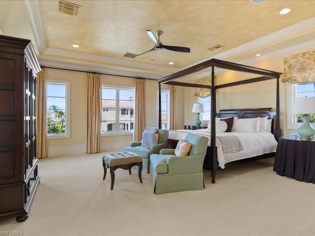 1550 Mullet Lane Naples, FL 34102 - Photo 35 of 50 a bedroom with furniture and a large window